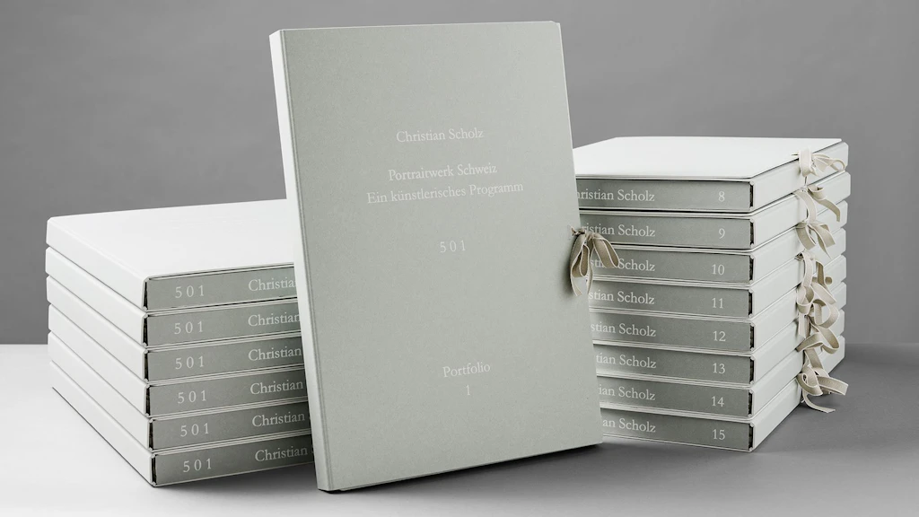 The 15 portfolios of the complete project, unopened.