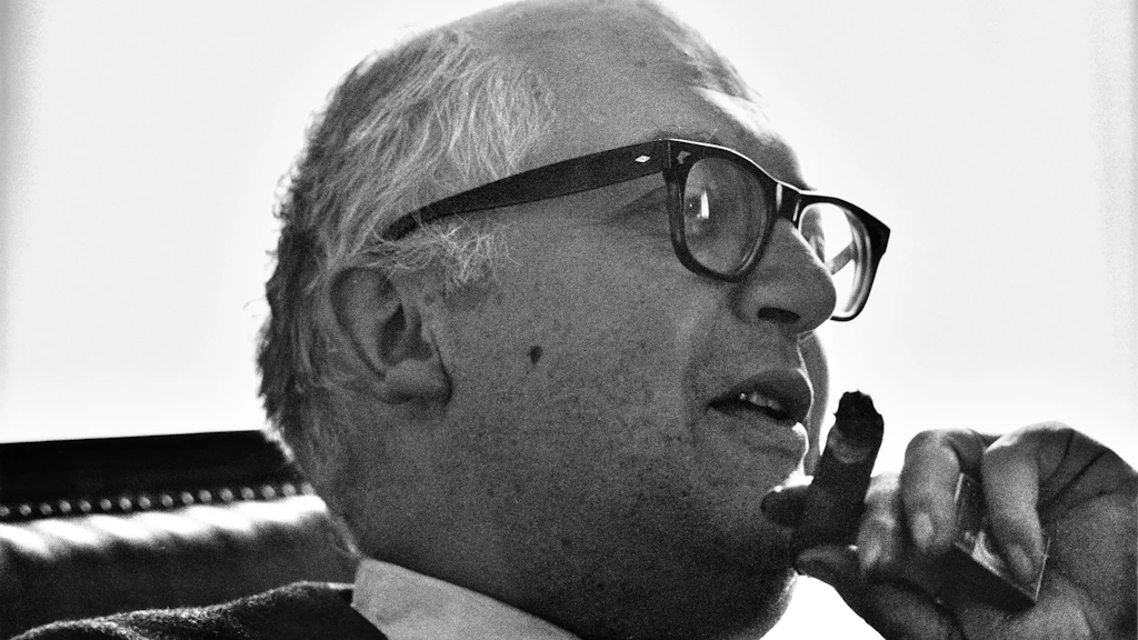 The writer Friedrich Dürrenmatt in 1961 smoking a cigar.