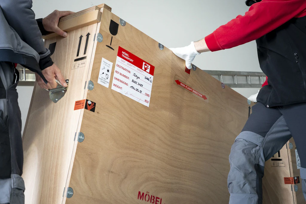 The transport crates containing the artwork are loaded into the truck.