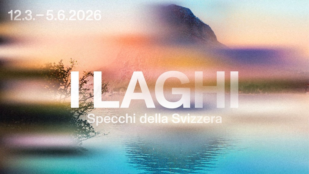 Uno sfondo sfocato con una montagna, un lago e una città