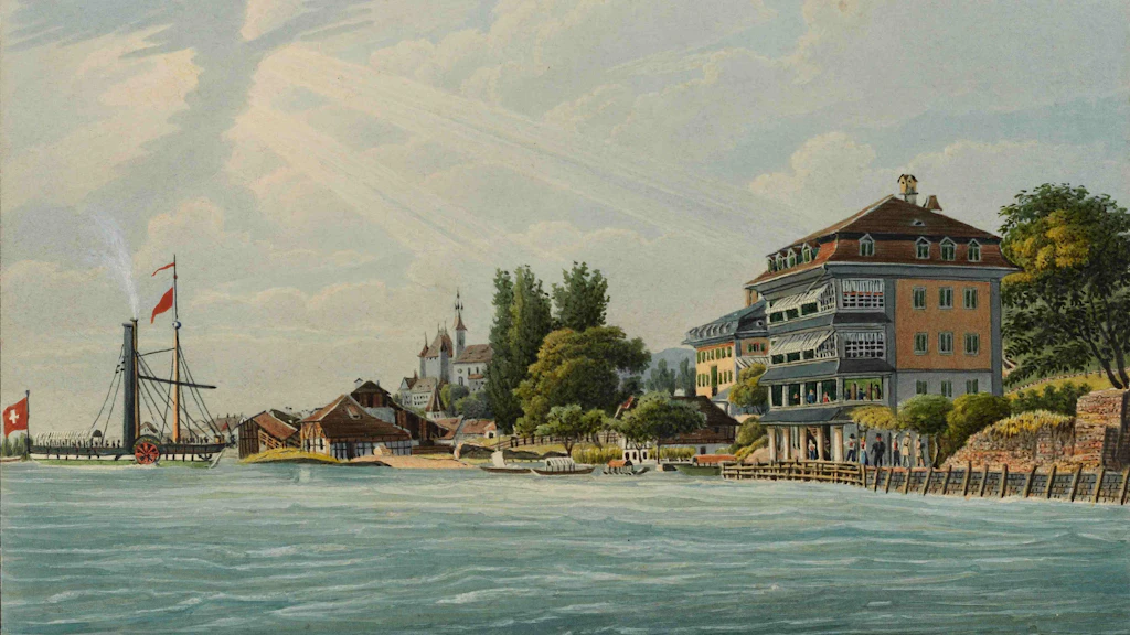 Questa stampa all’acquatinta mostra il Bellevue, il primo battello a vapore dell’Oberland bernese, in viaggio verso l’omonimo albergo di Thun. Sullo sfondo compare il castello di Thun